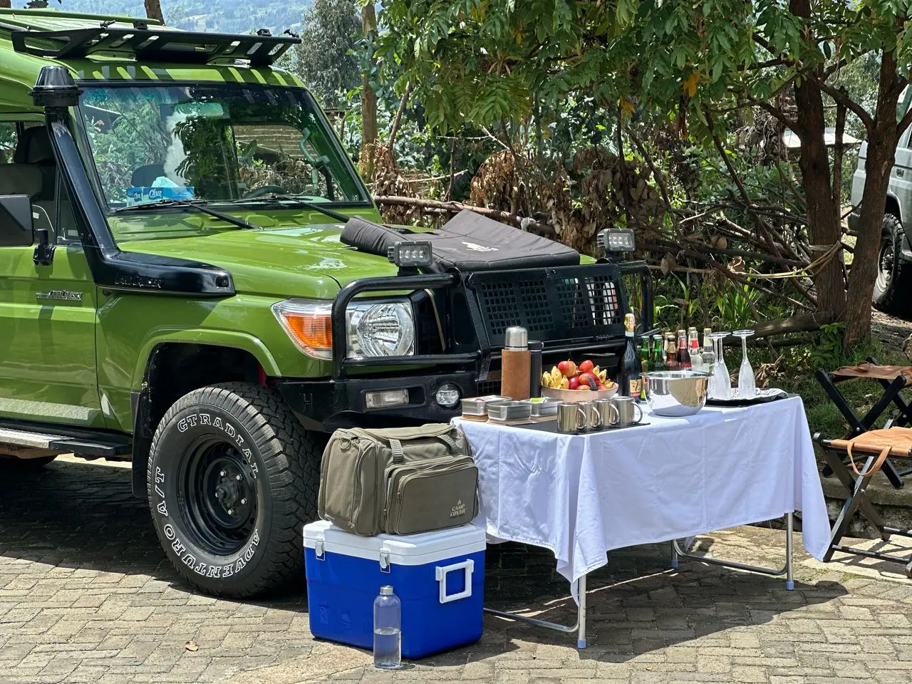 a safari vehicle parked for arranging breakfast before touring