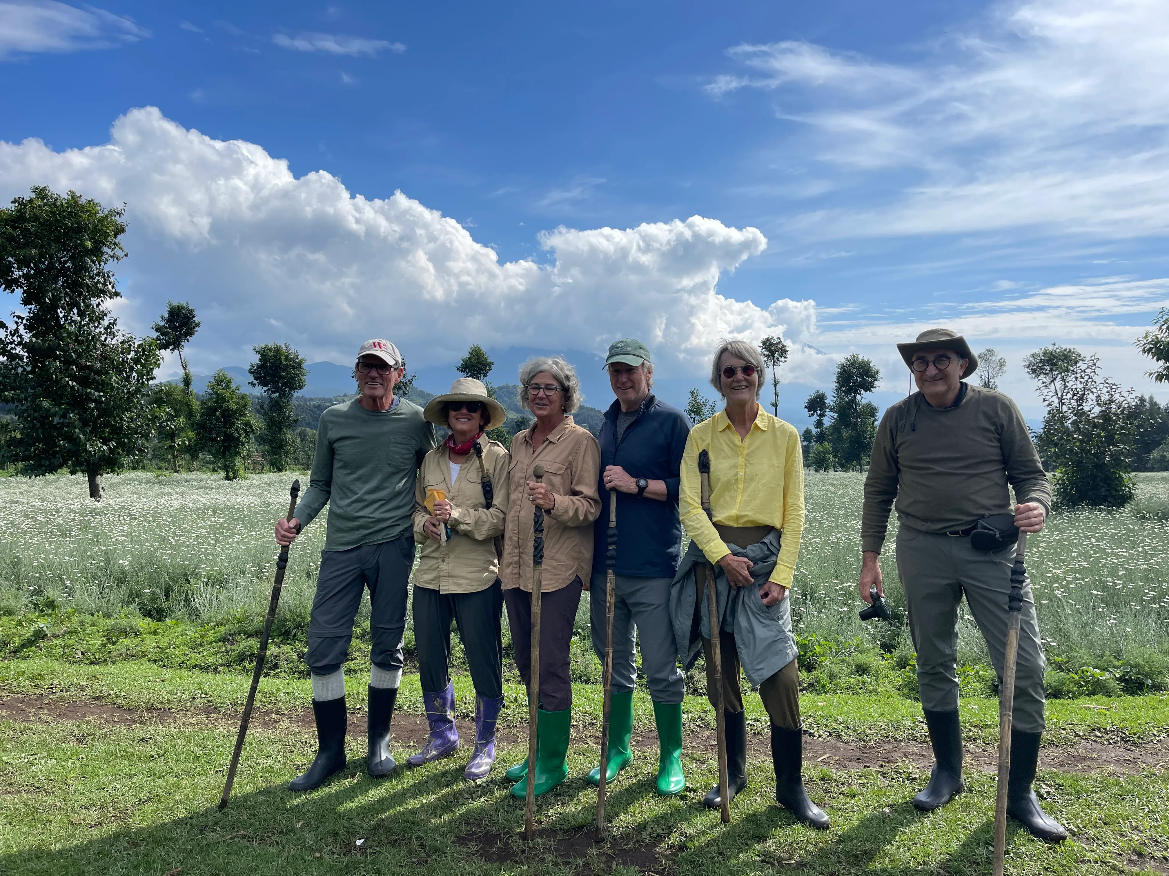 a group of happy tourist after mountain gorilla trekking in Volcanoes National Park